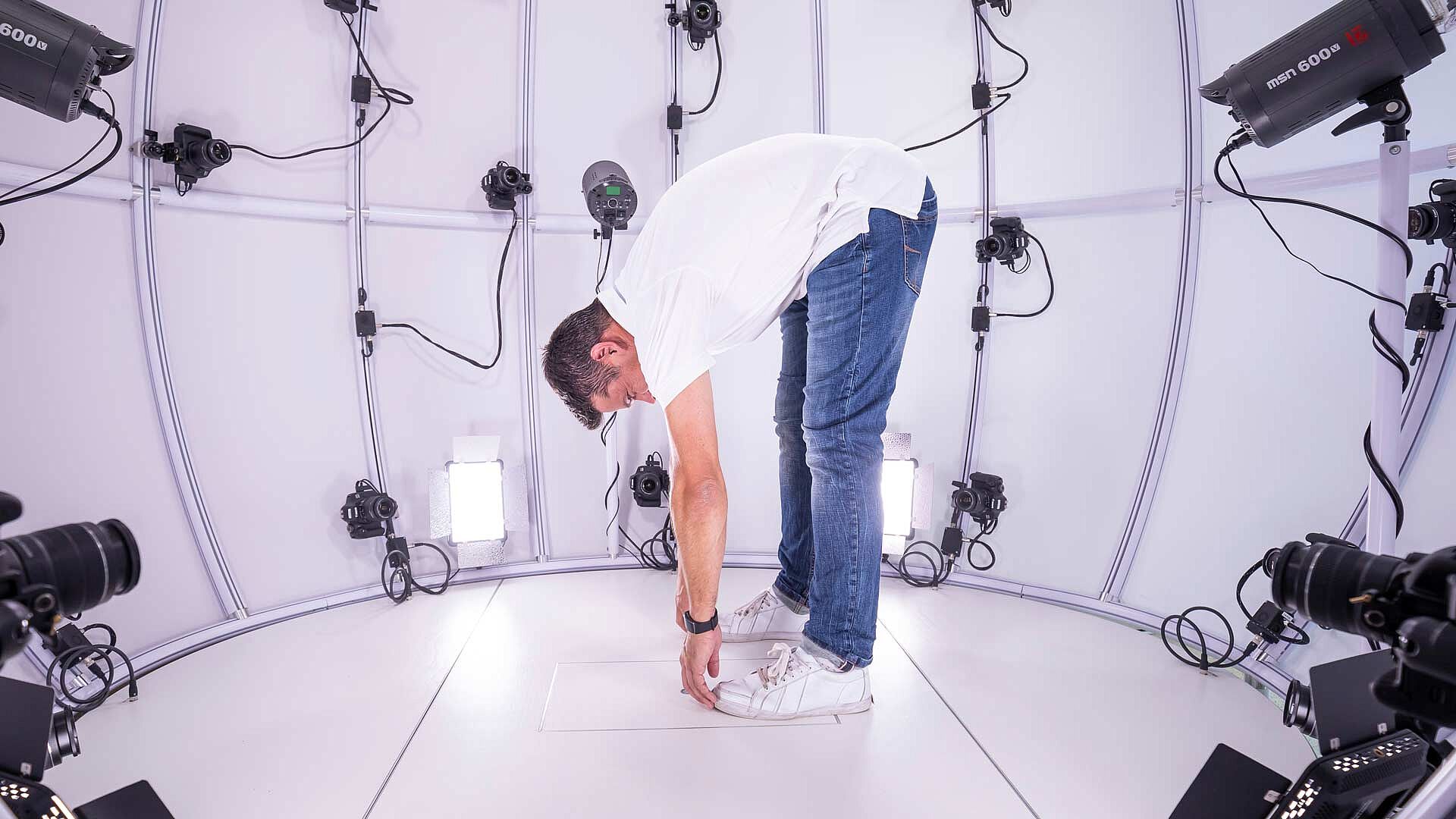 Man touching toes in Hohenstein's 4D Scanner