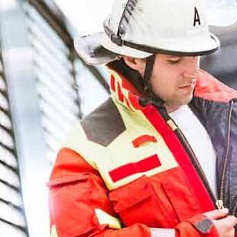 firefighter wearing certified PPE and helmet