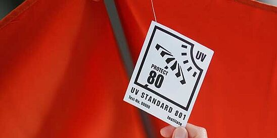 UV STANDARD 801 label on red umbrella