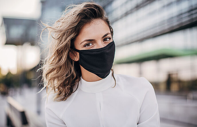 woman wearing black, cloth face mask