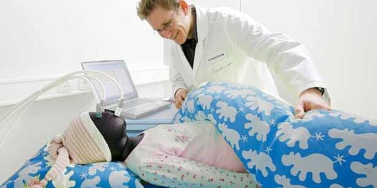 Testing bedding with child size thermal manikin at Hohenstein