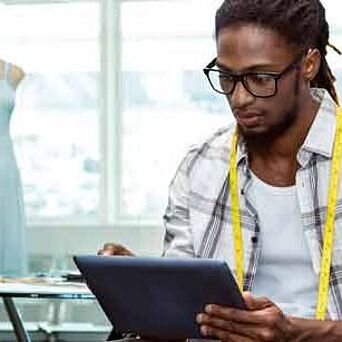 Additional Services Apparel designer using a tablet
