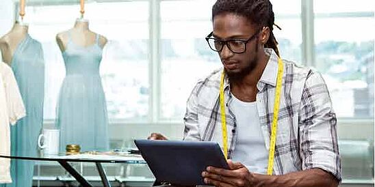 Additional Services Apparel designer using a tablet