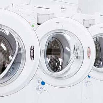 Row of home laundry machines in Hohenstein lab