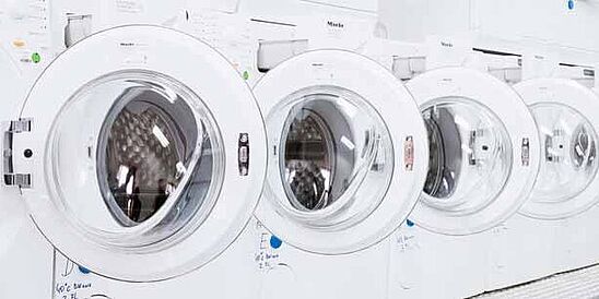 Row of home laundry machines in Hohenstein lab