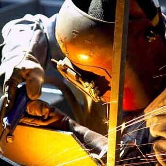 welder in PPE and helmet