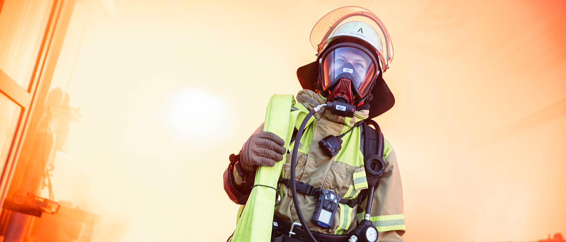 Firefighter wearing helmet and turnout gear