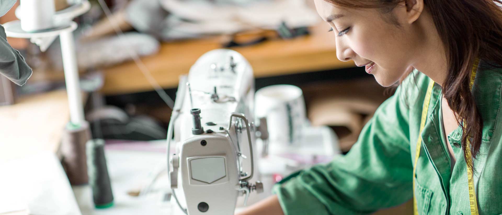 Textile worker in safe cut and sew facility