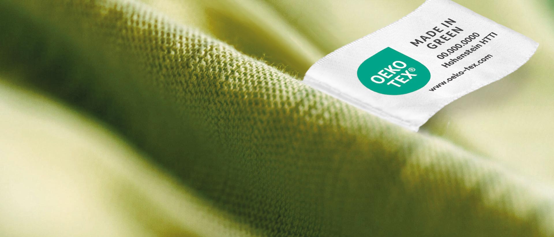 OEKO-TEX® MADE IN GREEN woven label sewn into sustainable green garment