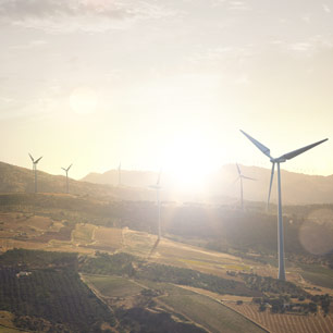 Field in Europe with wind turbines
