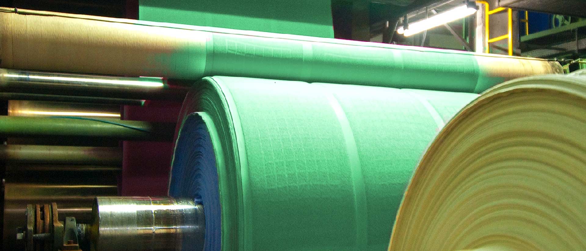 Fabric on large rolls in textile mill