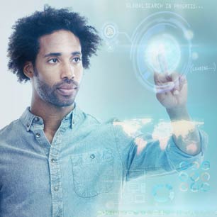 Man in denim shirt touching electronic screen