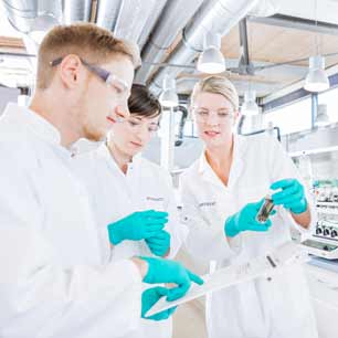 3 Hohenstein lab technicians analyzing research