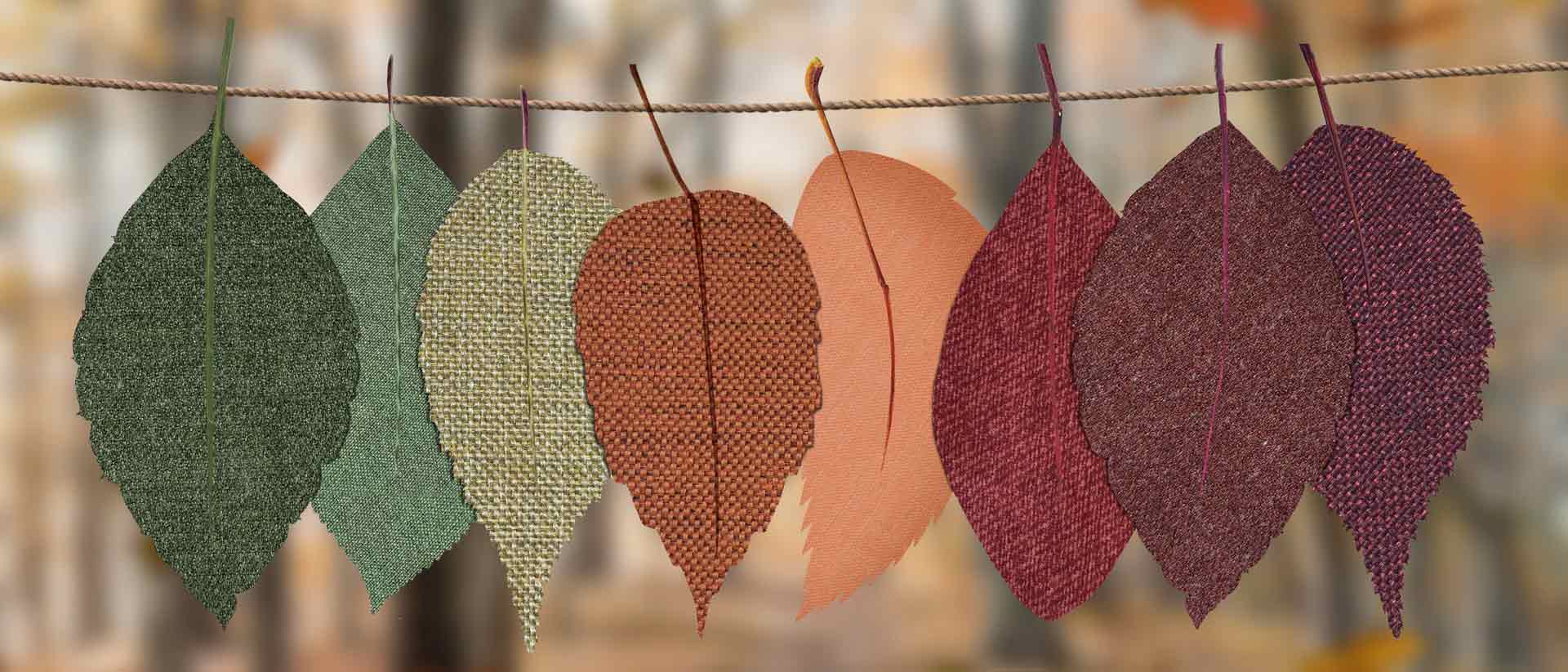 fall-colored, fabric leaves hanging on a line