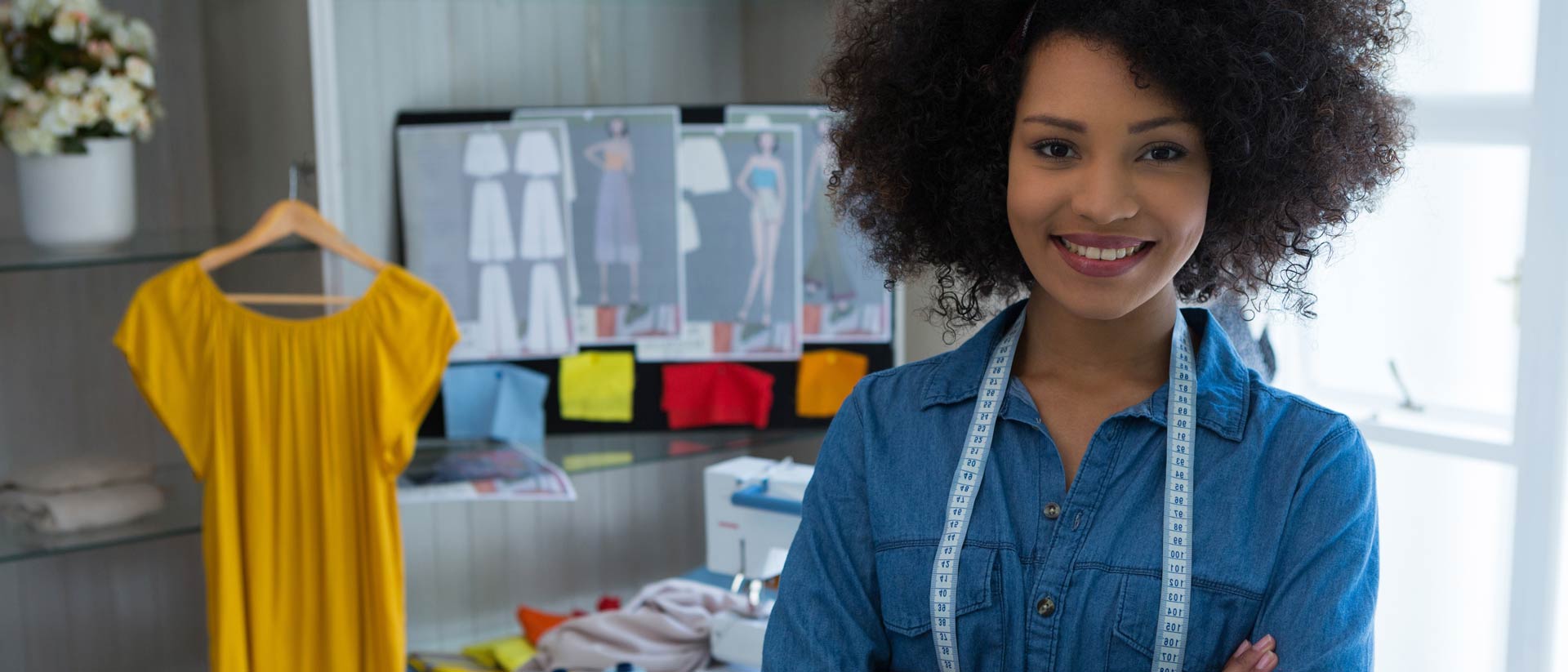 apparel designer wearing denim shirt in studio