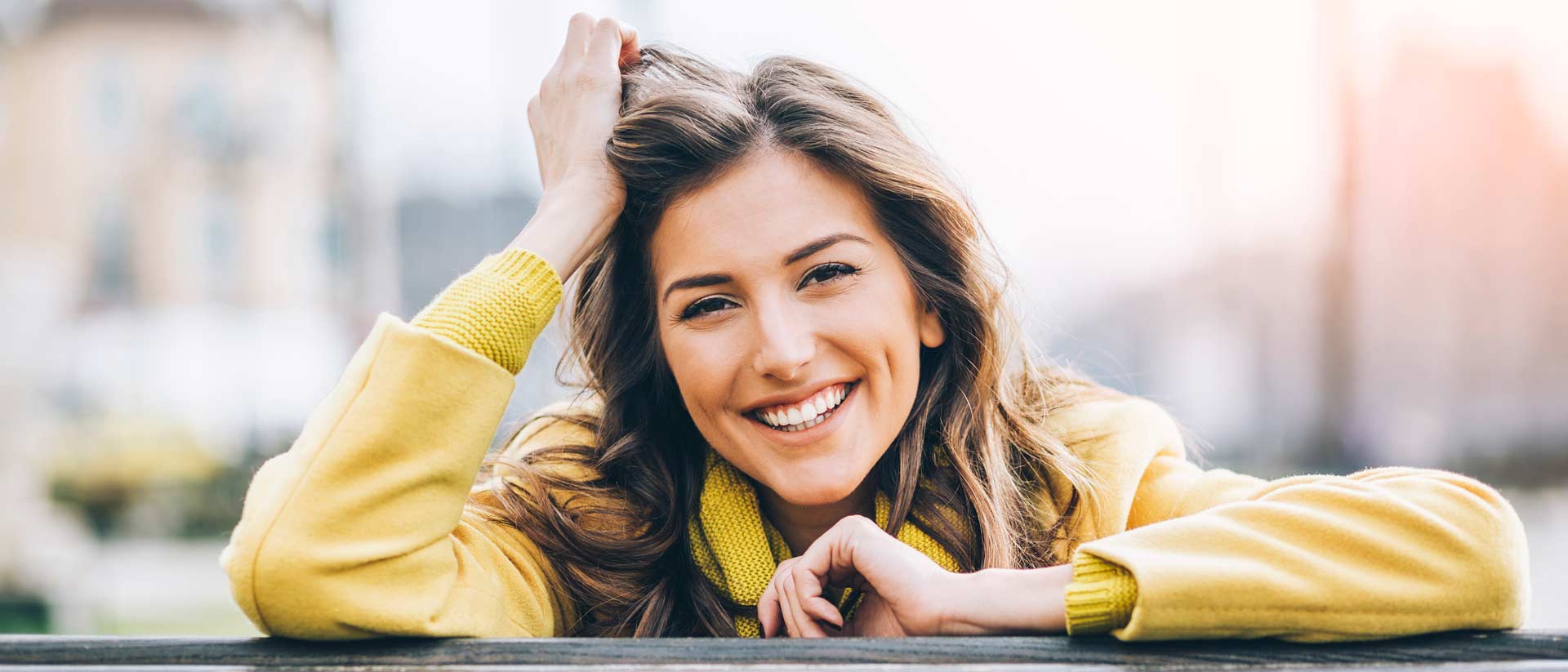 Woman in a yellow sweater.