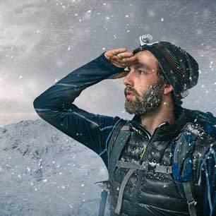 hiker on a snowy mountain wearing certified gear