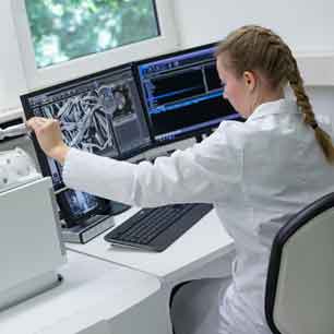 Hohenstein microbiologist using Scanning Electron Microscope