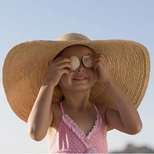 Girl wearing in sun hat and swimsuit