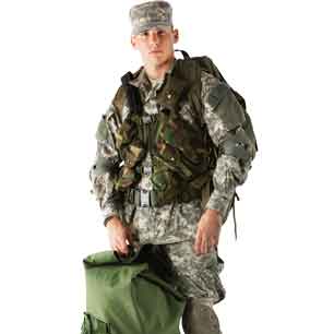 soldier in camoflage gear with backpack and vest